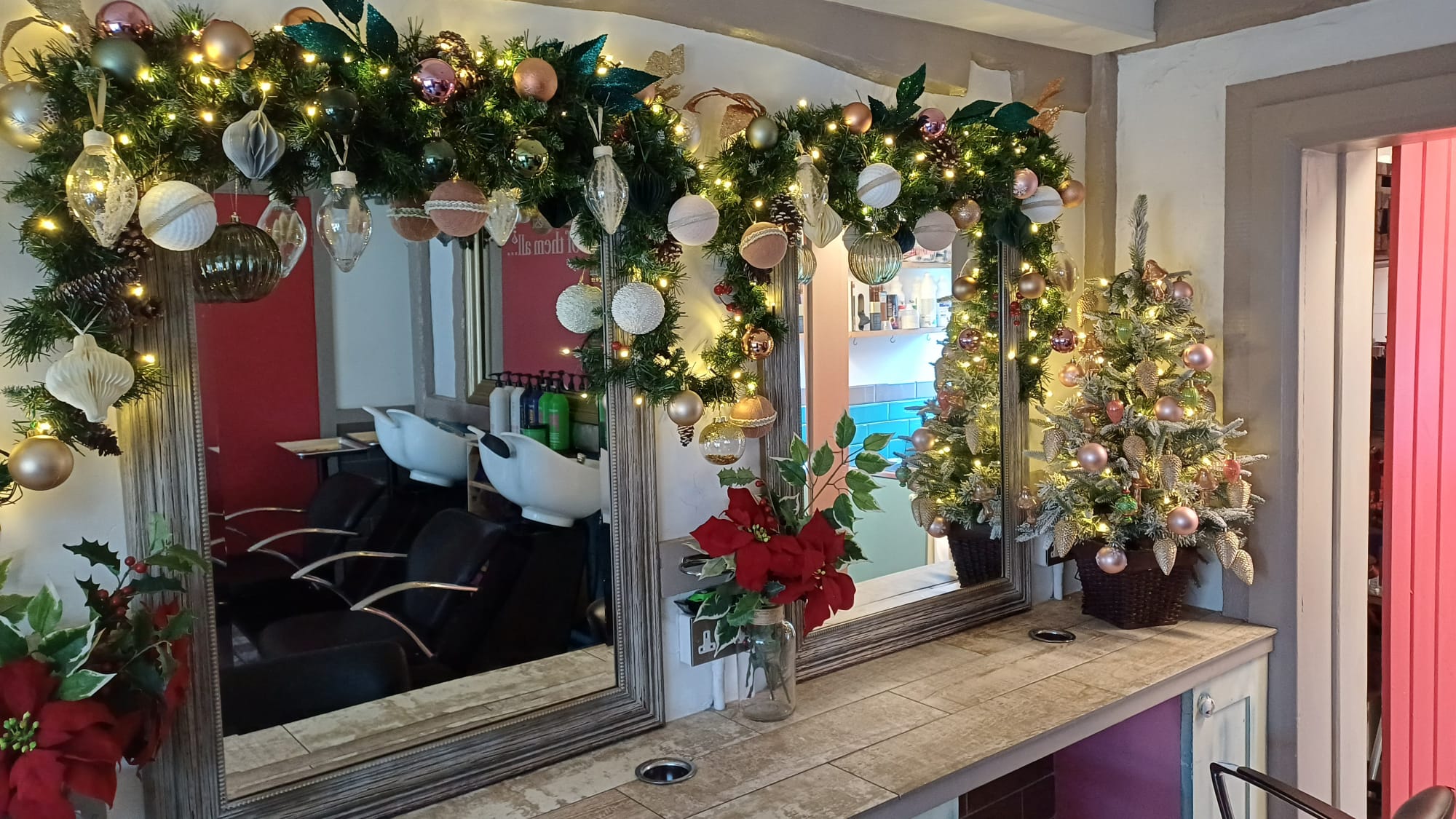 Howard's End salon mirrors, garlands and Christmas tree lit for the festive season