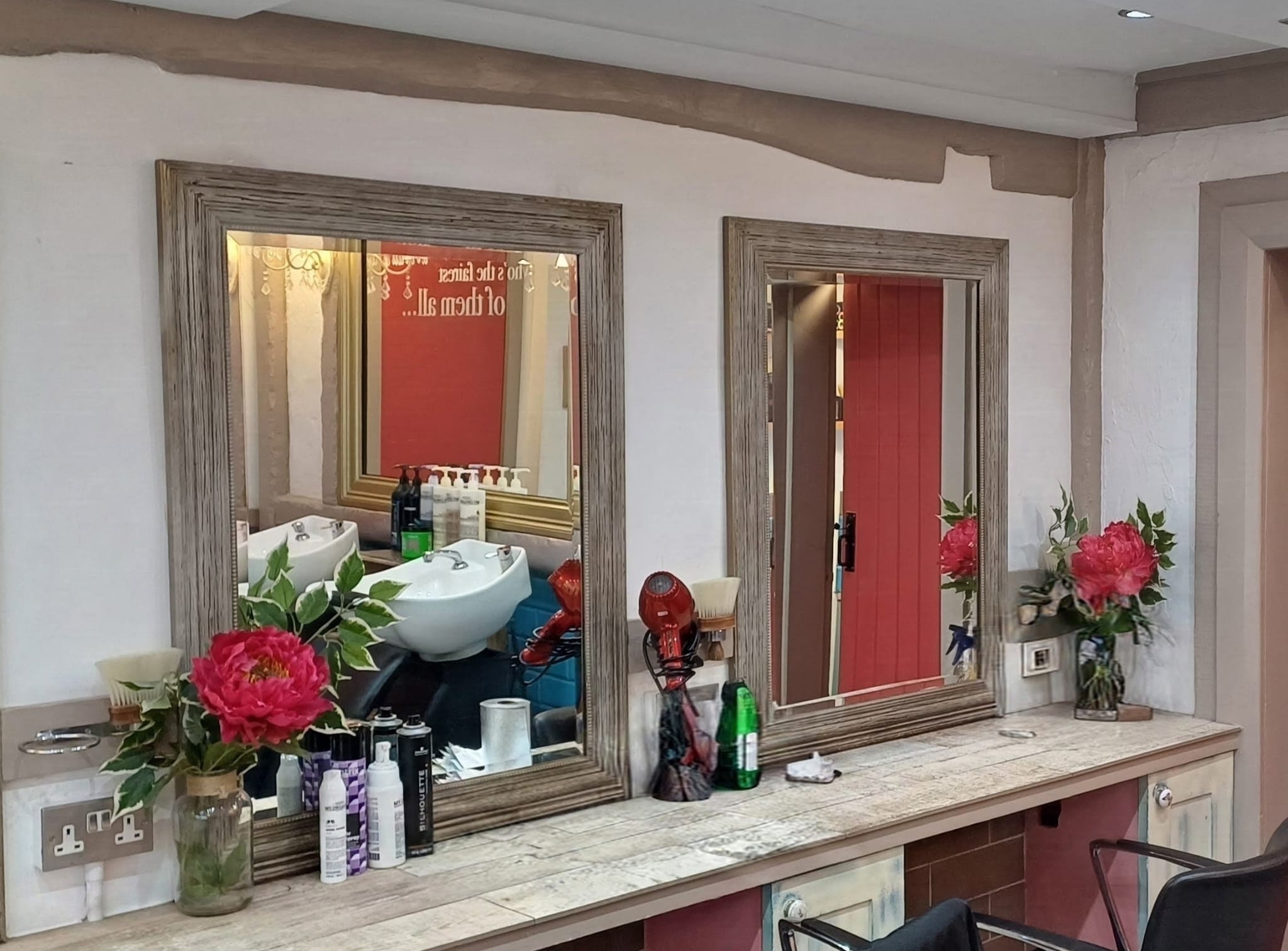 The styling mirrors and stations inside Howard's End salon
